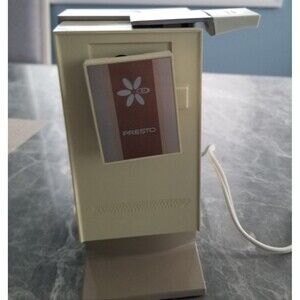 Vintage electric Presto can opener with built in knife sharpener.